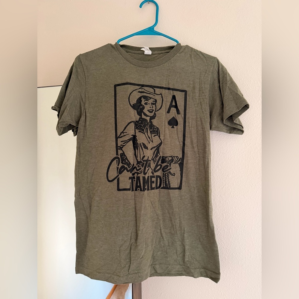 Can’t Be Tamed Olive Graphic T‑Shirt